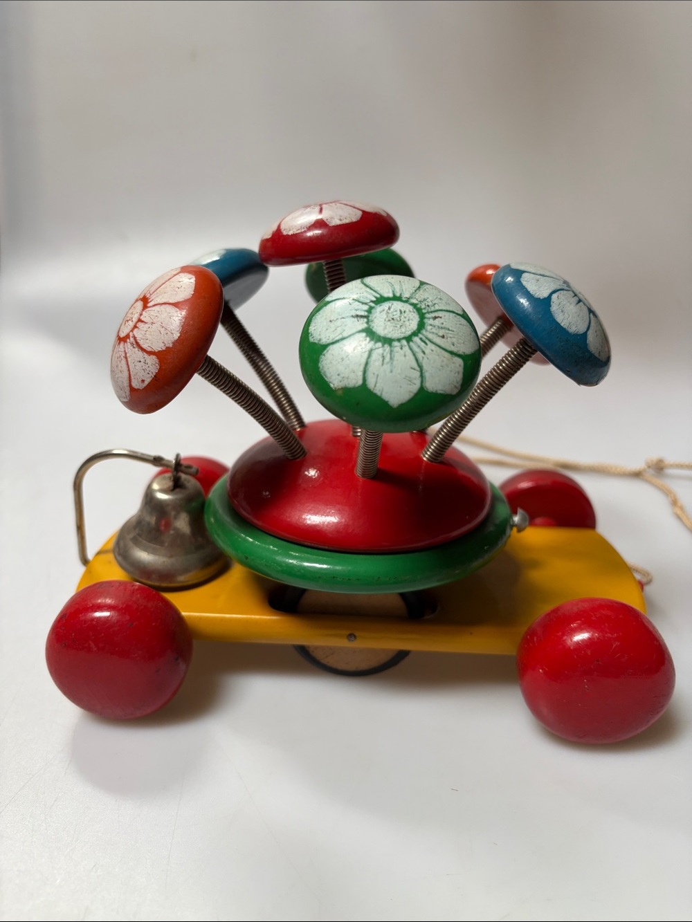 Vintage Kouvalias Wooden Pull Toy Rotating Flowers  1970s Bell Colorful MCM
